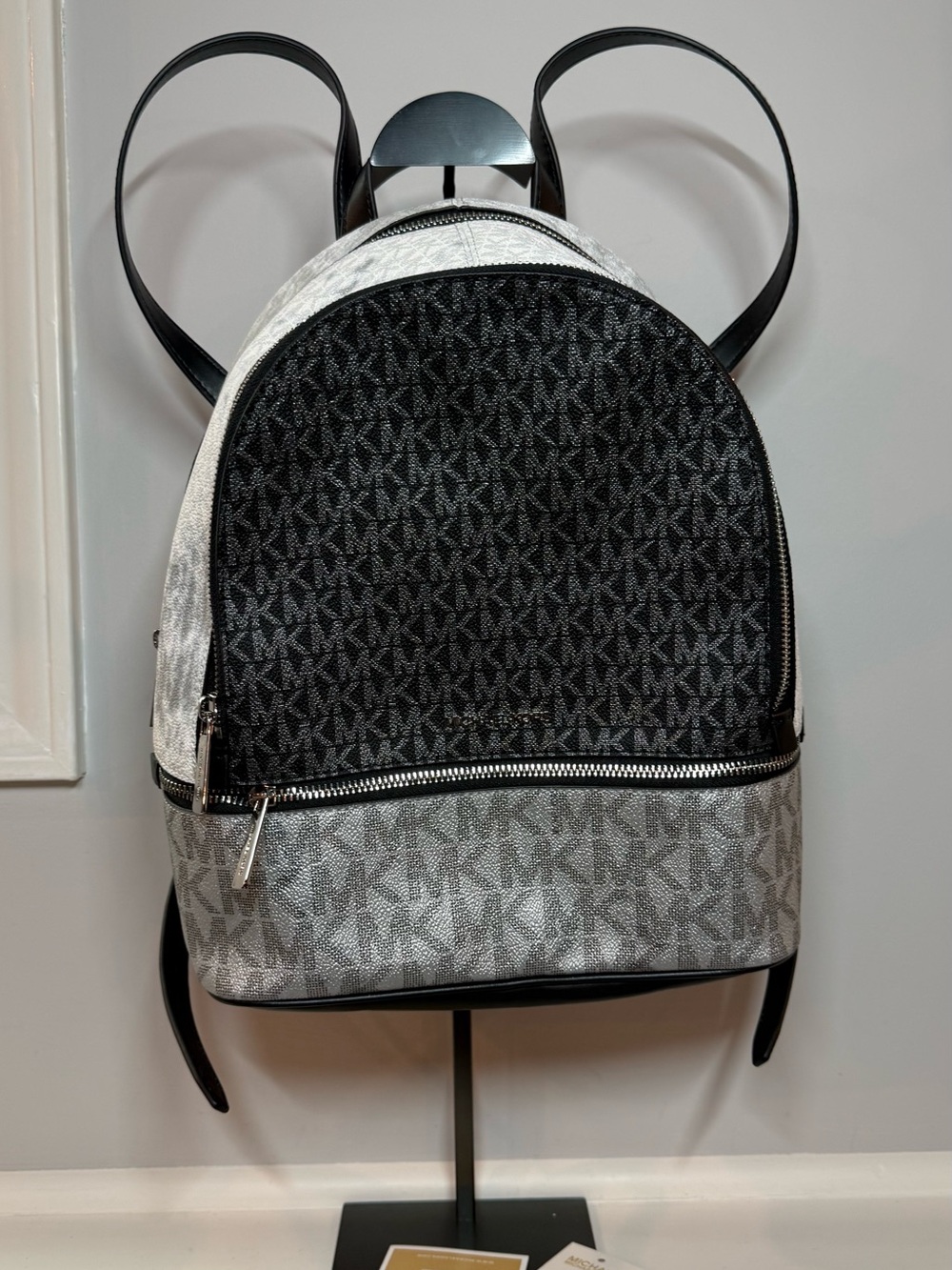 Rhea Medium Metallic Signature Logo Backpack with callout